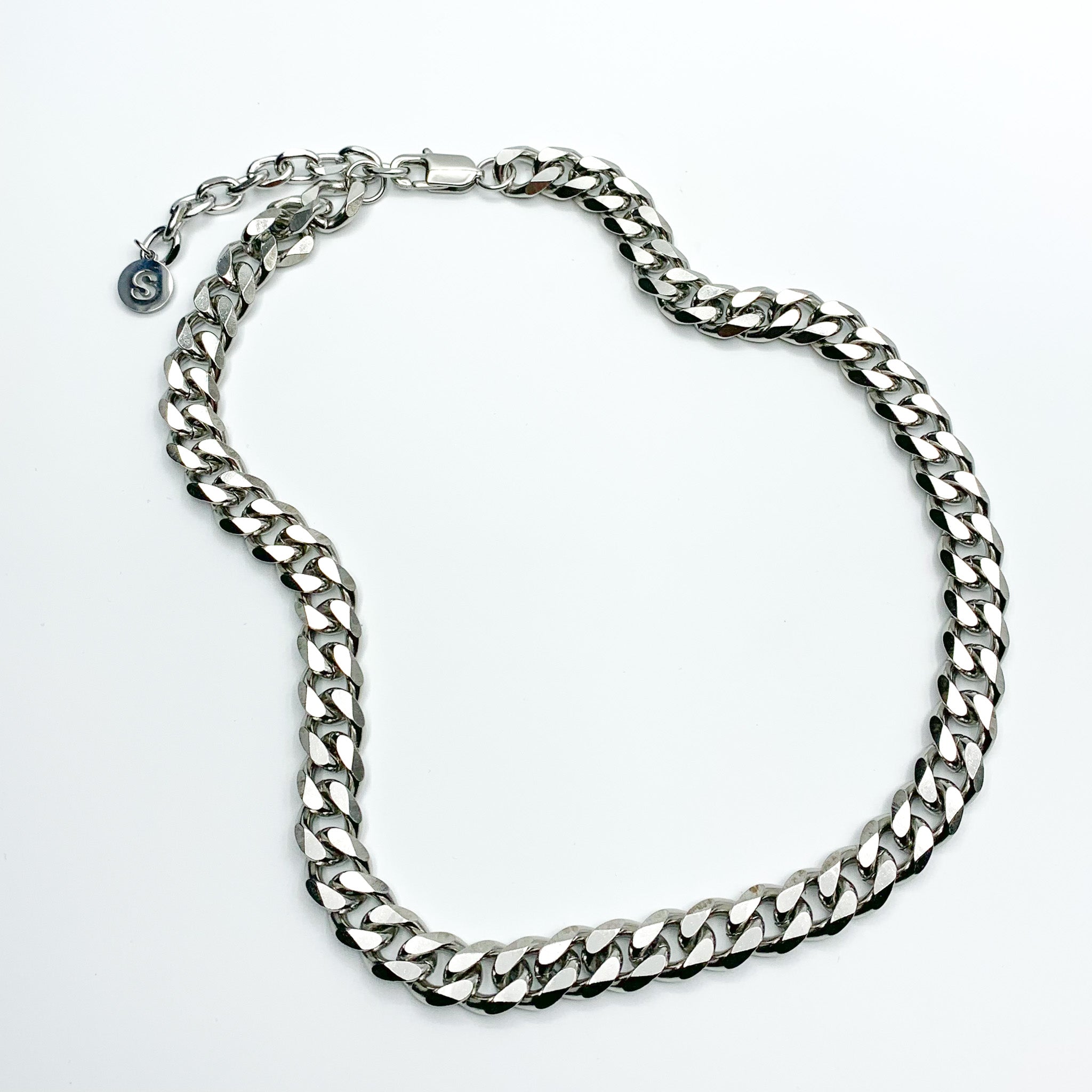 Upgrade your style with The Cuban Link 3.0 Chain, an enhanced version of our renowned Cuban Link Chain. Crafted from High-Quality Stainless Steel, this waterproof necklace ensures durability and style. Featuring an adjustable length varying up to 5cm for a customized fit, it's the perfect year-round accessory with a link width of 11cm.