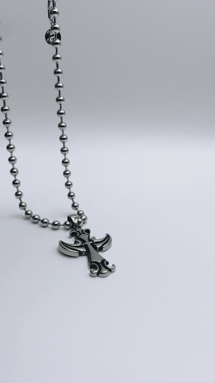 Video showcasing the Cross Chain #1 in its entirety, featuring the stainless steel ball chain (6mm) and the impressive cross pendant (54mm x 34mm). Experience the elegance and craftsmanship of this exquisite piece as it beautifully captures the essence of faith and style.